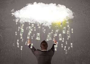 Business man in suit looking at cloud with falling money and sun